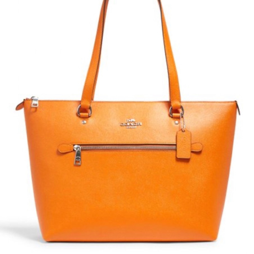 Authentic coach bag in mandarin. New without tags.